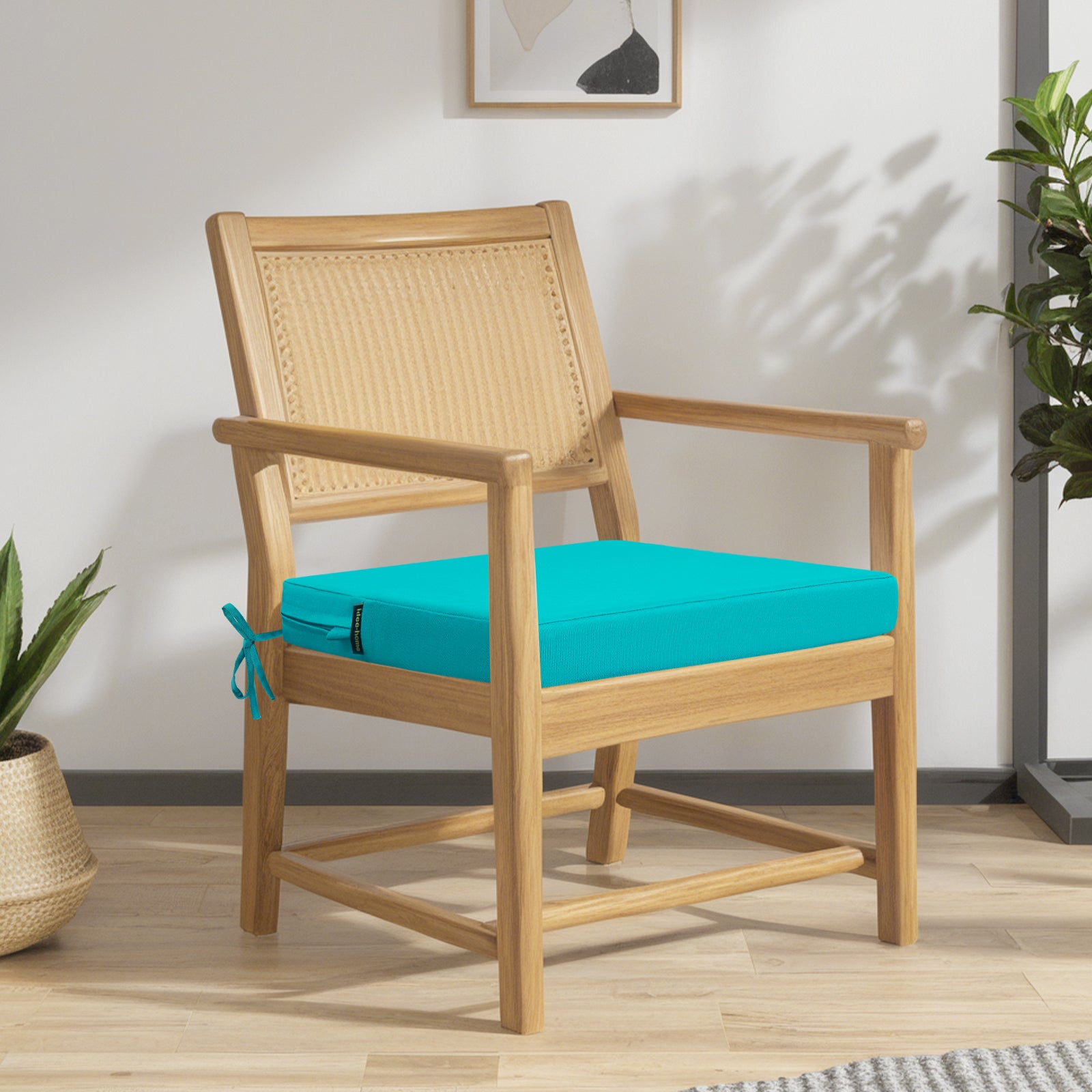 A wooden chair holds idee-home Outdoor Chair Cushions