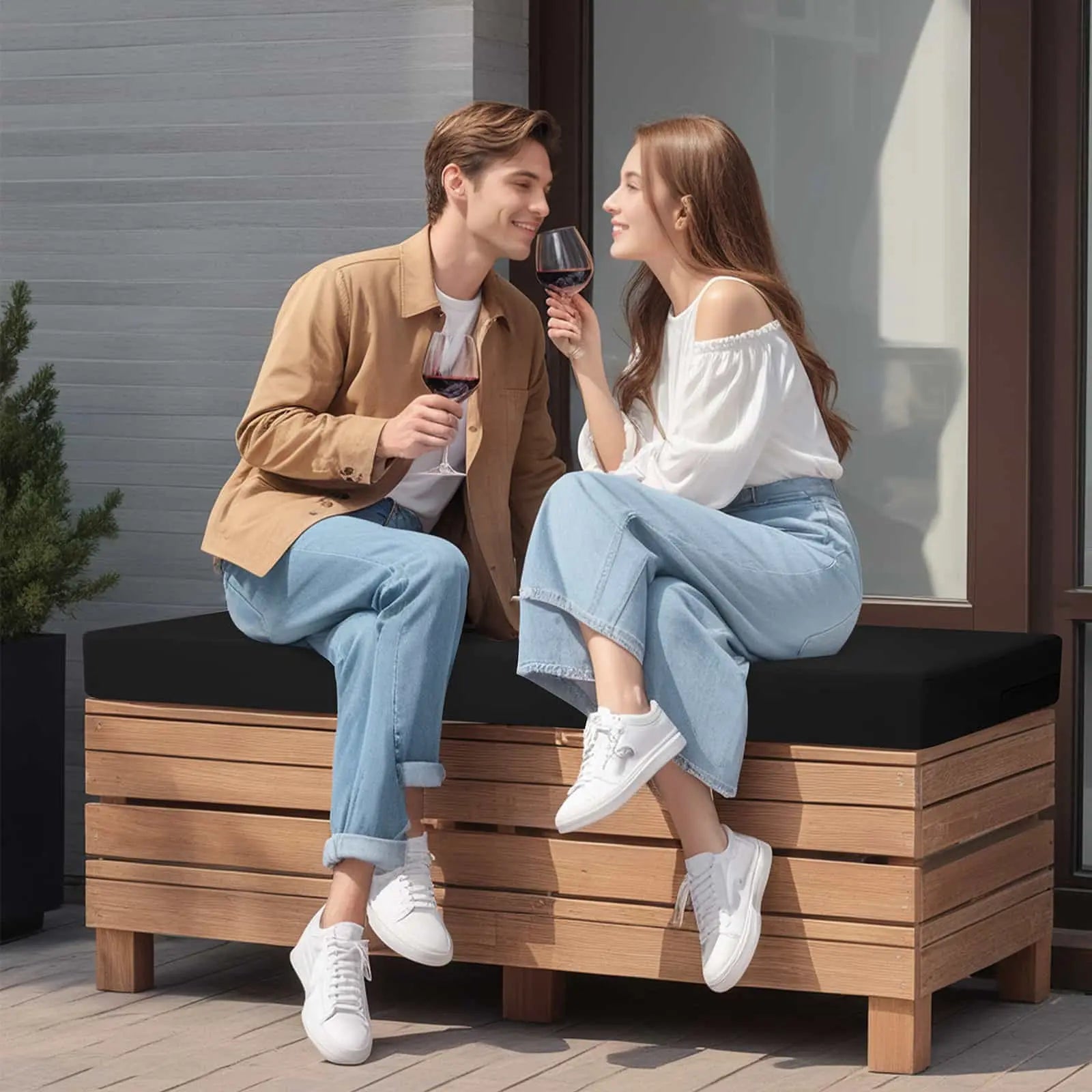 A couple sitting on Outdoor Loveseat Cushions