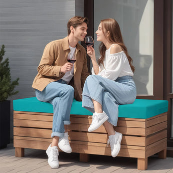 A couple sitting on Peacock Blue Outdoor Loveseat Cushions