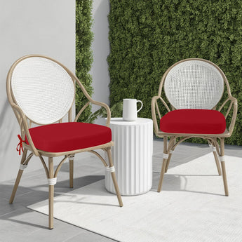 Red Colour Fastness idee-home Outdoor Chair Cushions on two rattan chairs in the sunshine